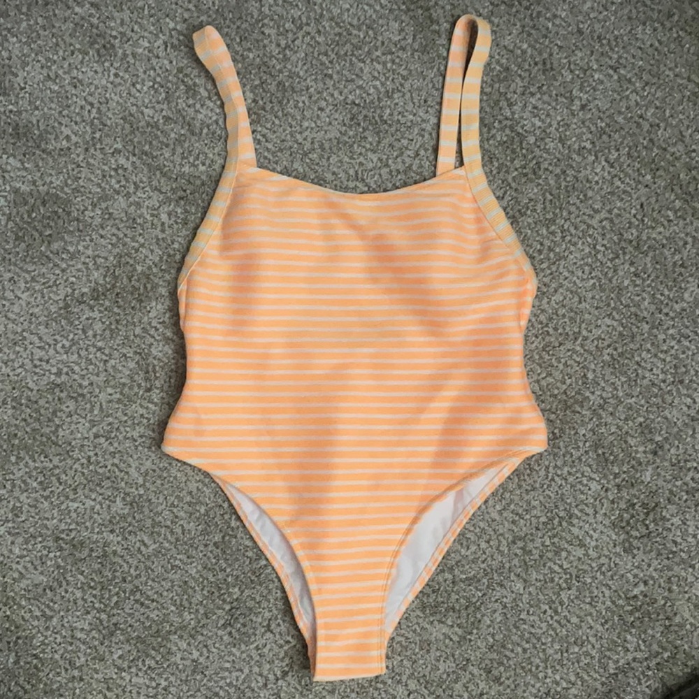Bright orange and white striped and ribbed bathing suit one piece